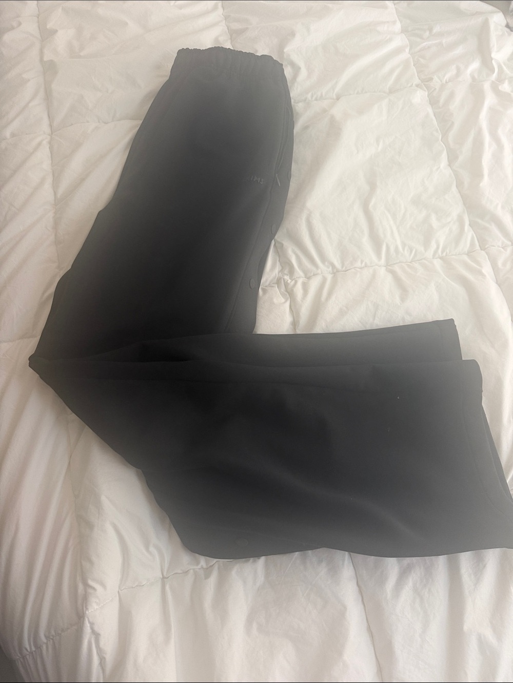 Skims track pants in black